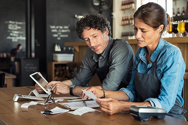 Cafe owners working on accounts